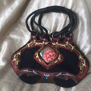 JL Lane “crossing borders” hand-embroidered artisan handbag.